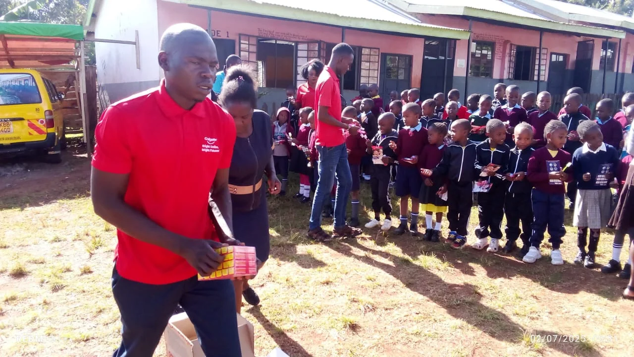 Children in school uniforms gathered for a community activity at Restoration